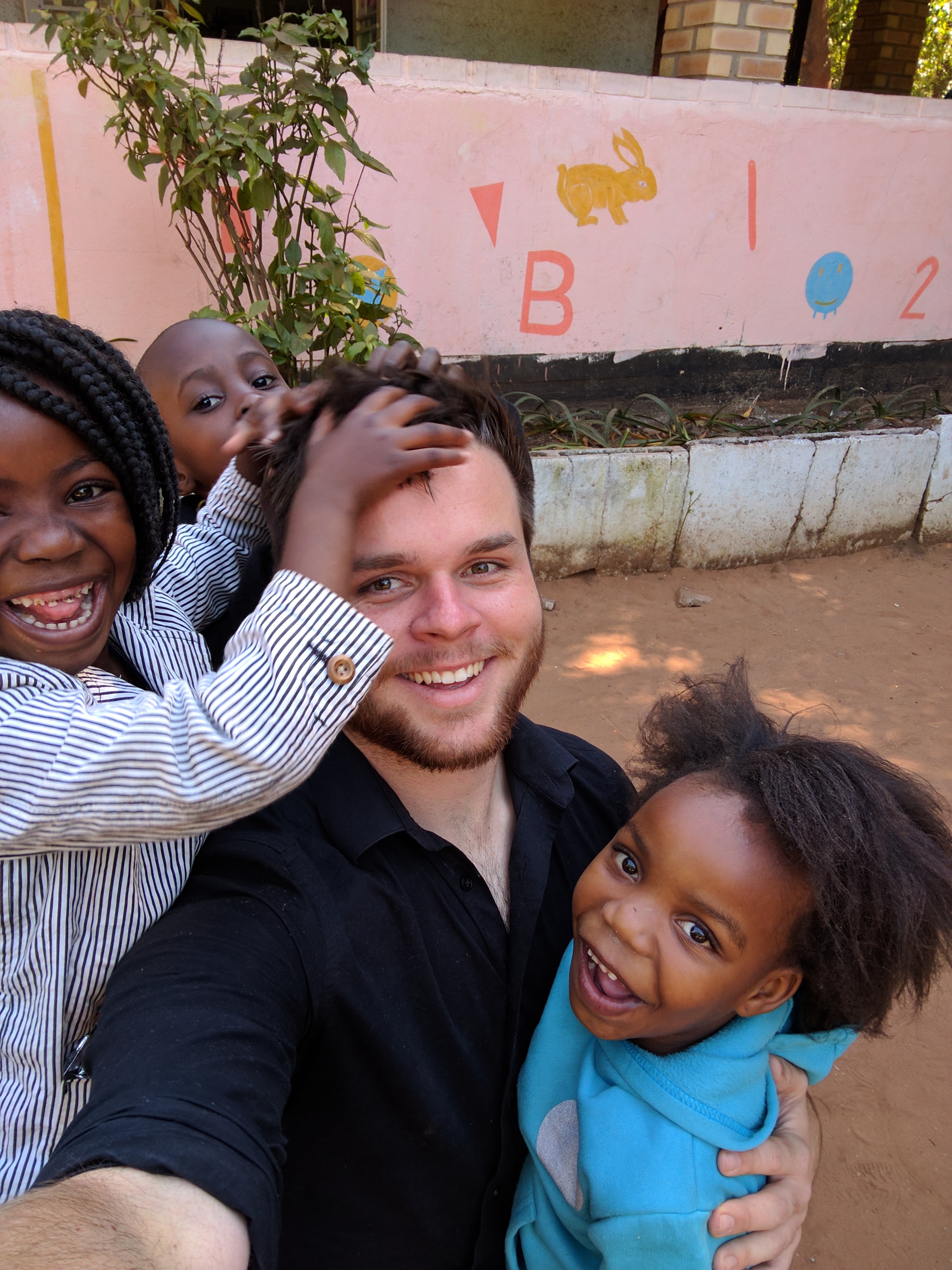 Chase Whittaker with children from Zambia.